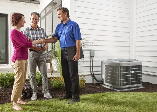 dealer-couple-outside-installed-AC